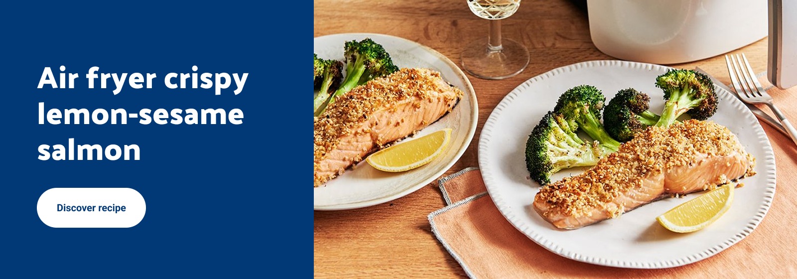 Text Reading: "Air fryer crispy lemon-sesame salmon with broccoli on a wooden table. For more details, check CTA Discover more."